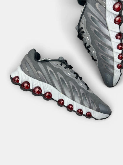 Nike Air Max DN8 “Iron Grey / Bright Crimson” DN8 Grey Crimson — buty sportowe męskie w bardzo dobrym stanie rozmiar 44.5, wewnętrzny panel lewego buta