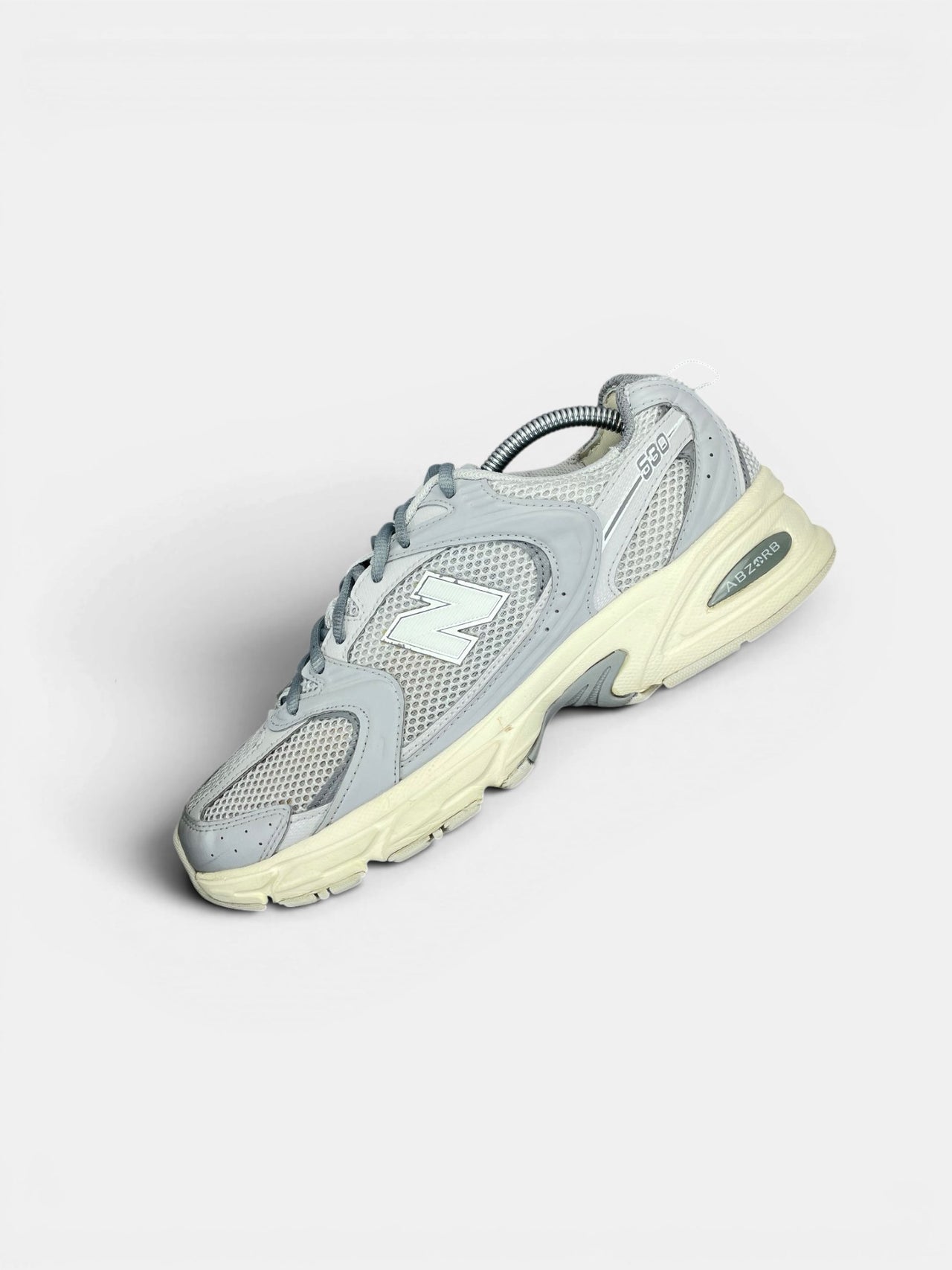 New Balance 530 ABZORB — buty sportowe męskie w bardzo dobrym stanie rozmiar 43, zewnętrzny panel lewego buta