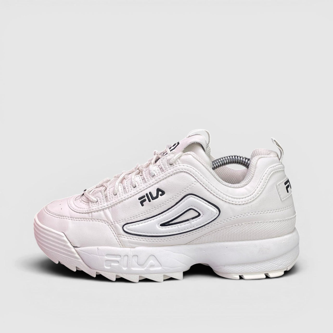 Fila Disruptor — buty sportowe damskie w bardzo dobrym stanie rozmiar 39, boczny profil, lewa strona