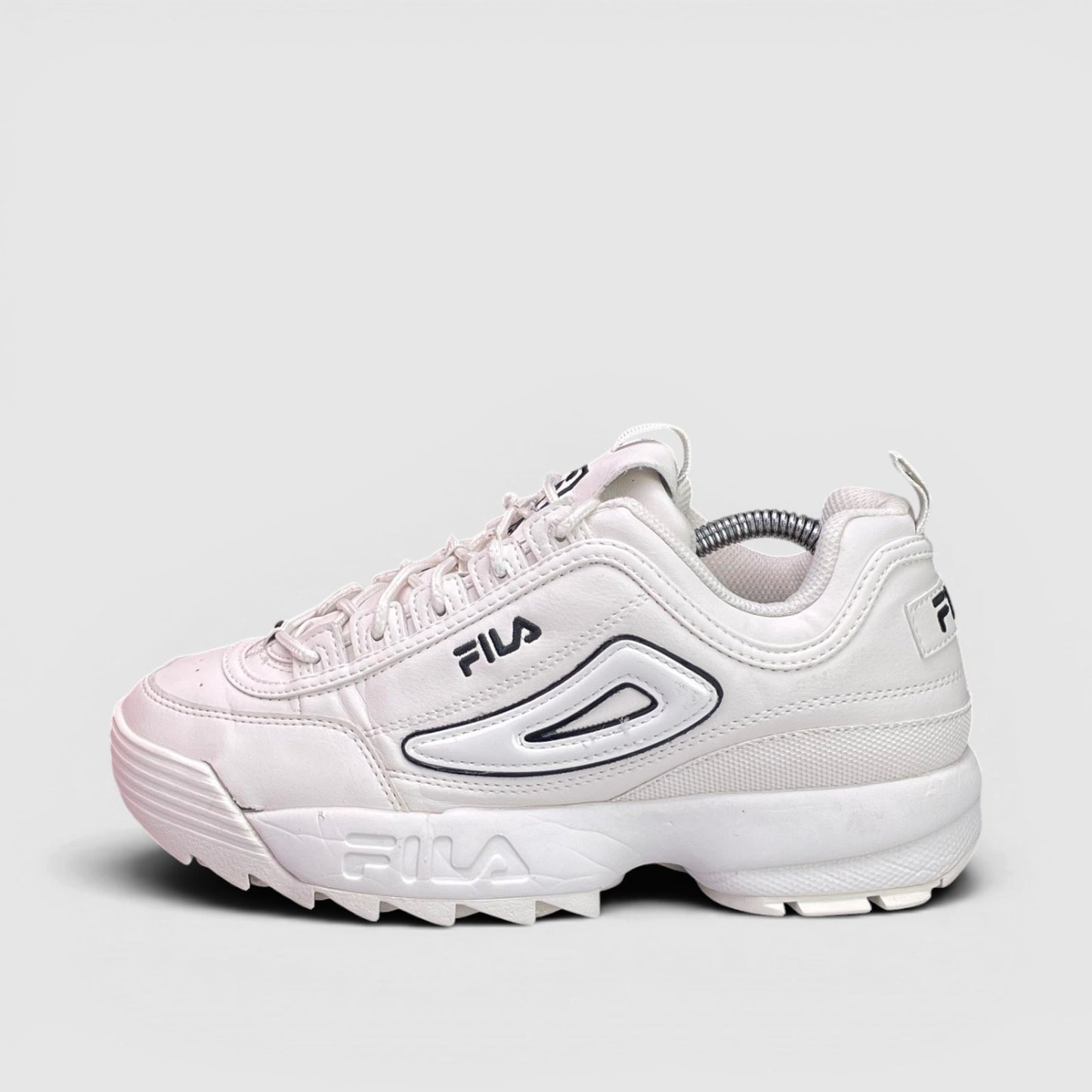 Fila Disruptor — buty sportowe damskie w bardzo dobrym stanie rozmiar 39, boczny profil, lewa strona